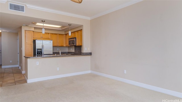 kitchen featuring light carpet, visible vents, baseboards, appliances with stainless steel finishes, and ornamental molding