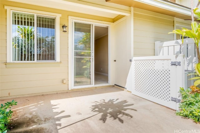 entrance to property with a patio