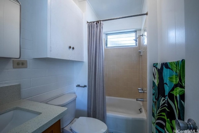 full bathroom featuring vanity, toilet, and shower / tub combo with curtain