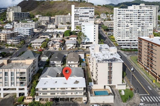 birds eye view of property featuring a mountain view