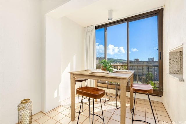 dining area with light tile patterned floors