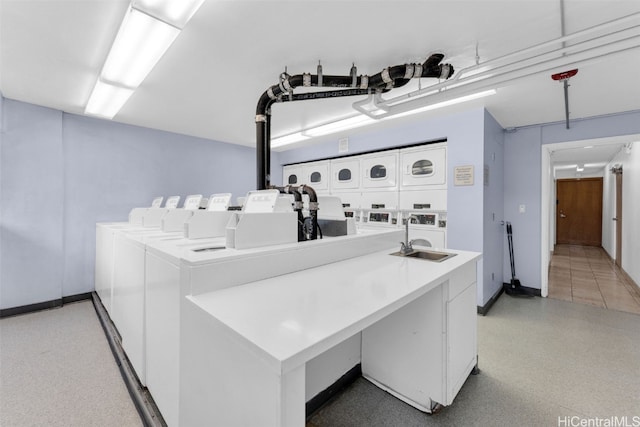 clothes washing area featuring separate washer and dryer and stacked washer / dryer