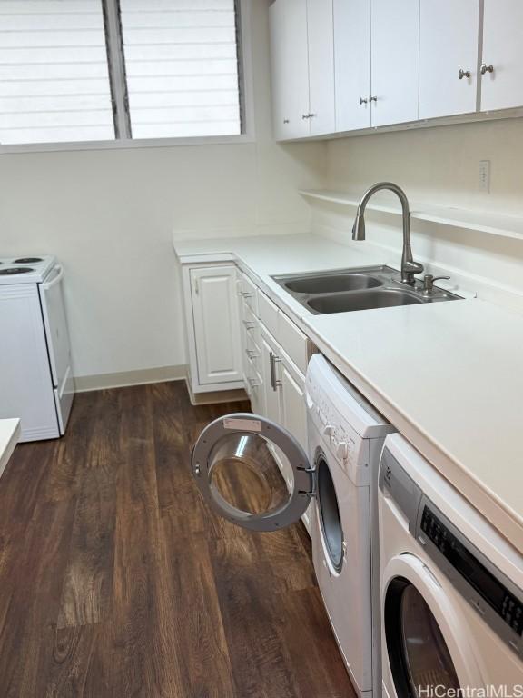 laundry room with separate washer and dryer, sink, cabinets, and dark hardwood / wood-style flooring