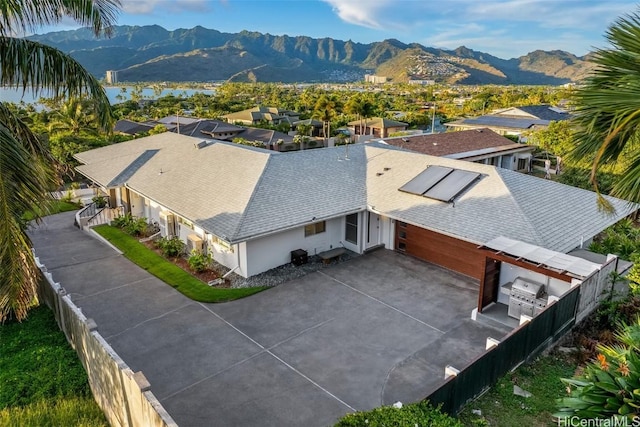 drone / aerial view featuring a mountain view