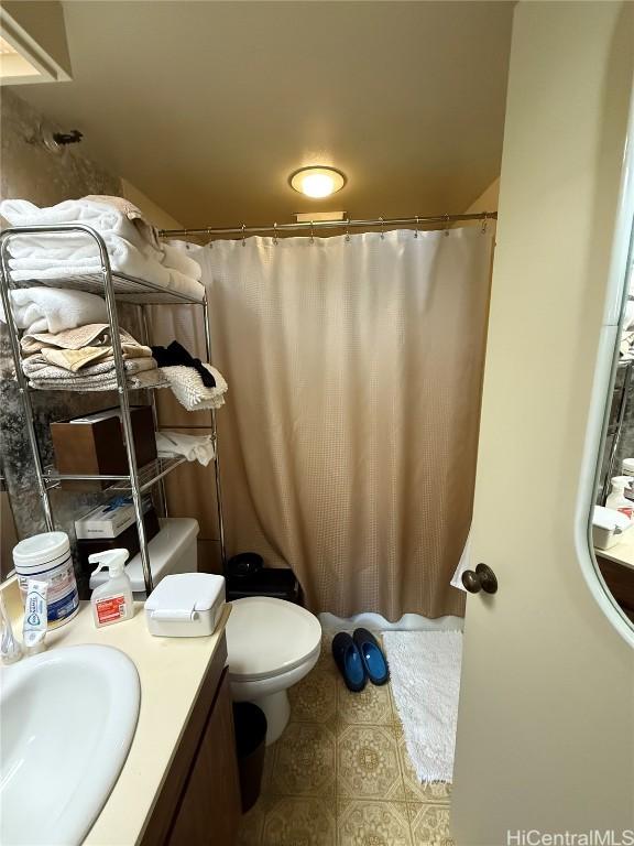 bathroom featuring toilet and vanity