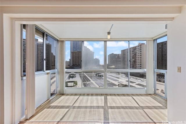 unfurnished sunroom with plenty of natural light