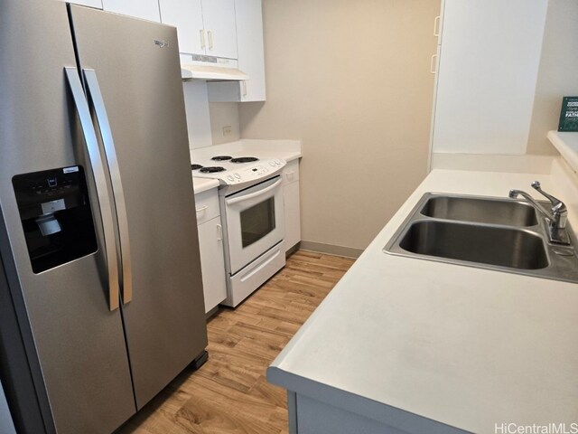 kitchen with stainless steel fridge, sink, white cabinets, electric range, and light hardwood / wood-style floors