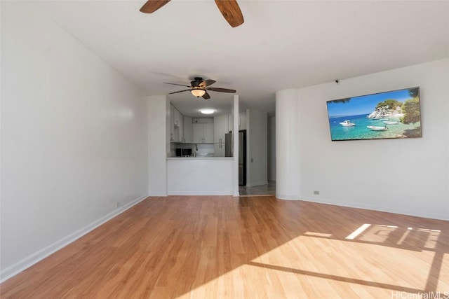 unfurnished living room with light hardwood / wood-style floors