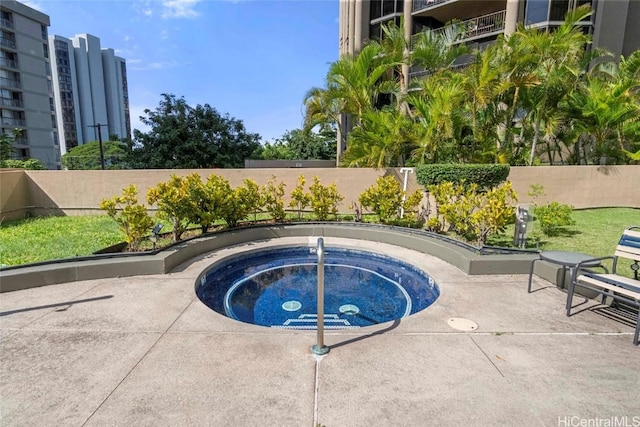 view of swimming pool featuring a community hot tub