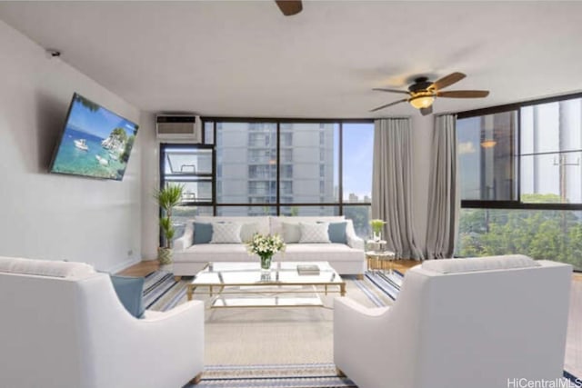 living room with a wall mounted air conditioner, ceiling fan, and expansive windows