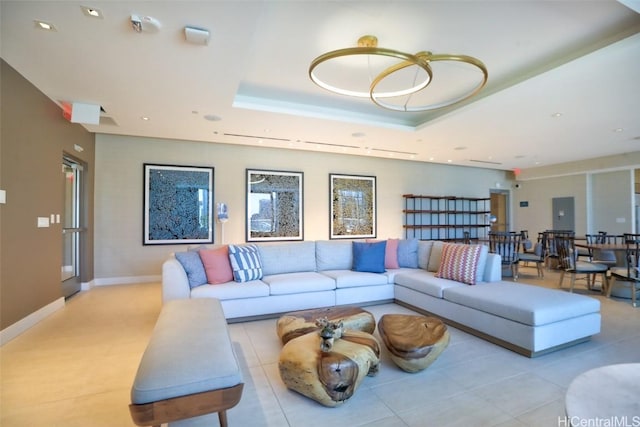 living room featuring a tray ceiling