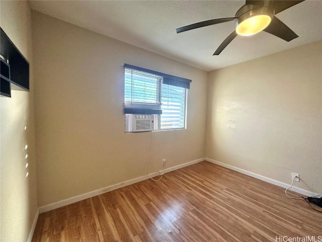 empty room featuring hardwood / wood-style floors and ceiling fan