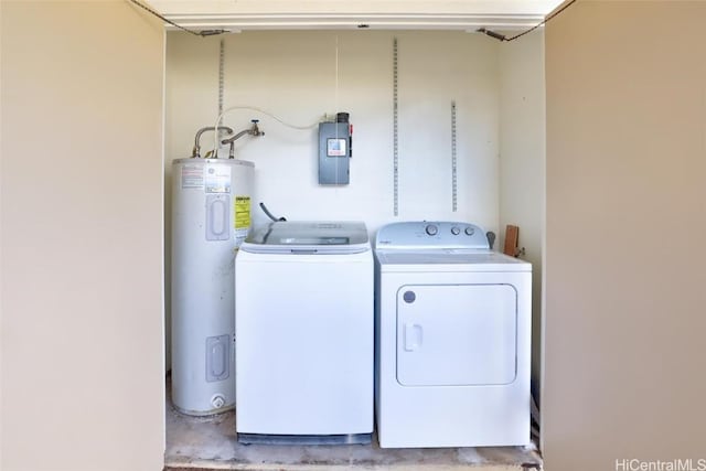 laundry area with washing machine and clothes dryer and electric water heater