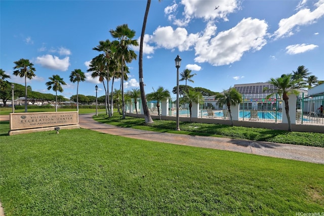 91-1022 Kaiau Ave Unit 3B, Kapolei, HI 96707 - surrounding community featuring a lawn and a pool