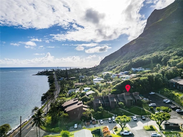 drone / aerial view featuring a water and mountain view