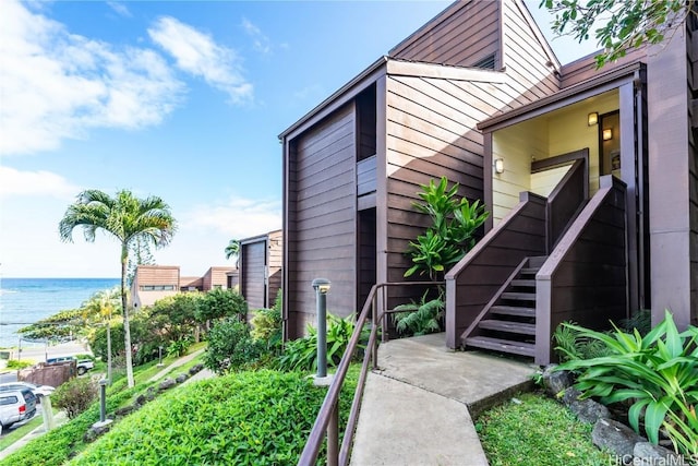 view of property exterior featuring a water view