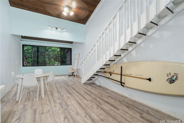 interior space featuring wooden ceiling, hardwood / wood-style flooring, and lofted ceiling