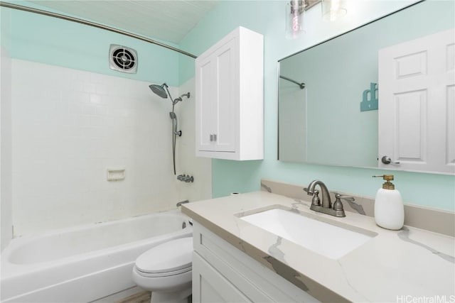 full bathroom with vanity, toilet, and tiled shower / bath