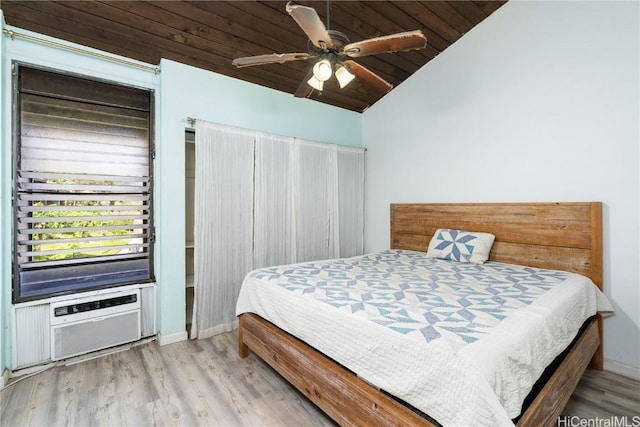 bedroom featuring ceiling fan, light hardwood / wood-style floors, wooden ceiling, and vaulted ceiling