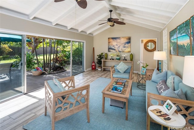 sunroom / solarium featuring lofted ceiling with beams and ceiling fan