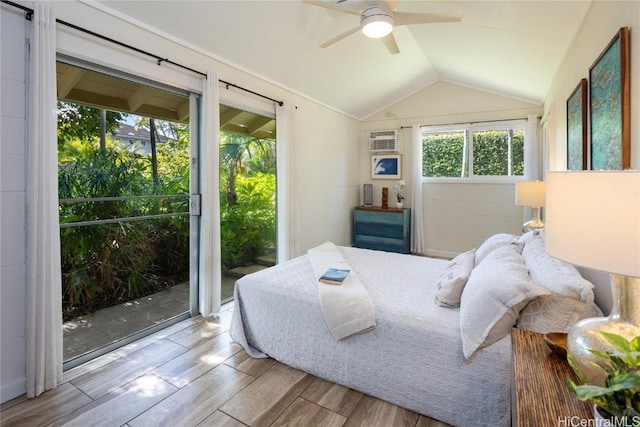 bedroom with lofted ceiling, access to outside, light hardwood / wood-style flooring, ceiling fan, and a wall unit AC