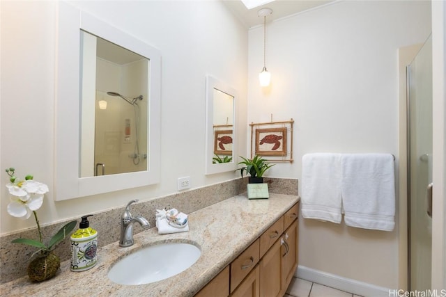 bathroom featuring tile patterned flooring, vanity, and a shower with shower door