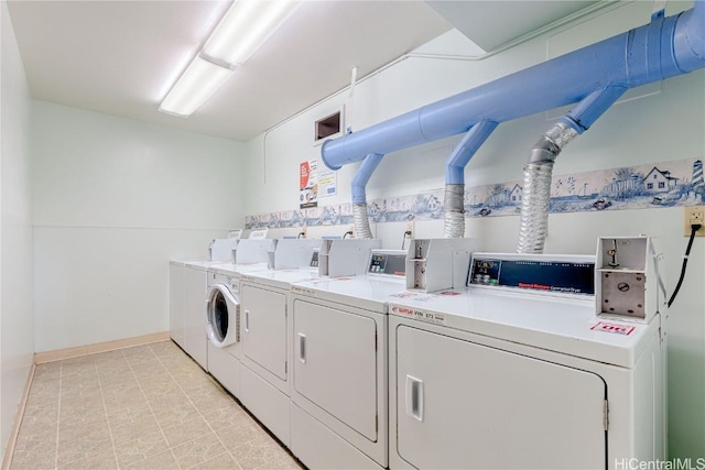 washroom featuring washing machine and clothes dryer