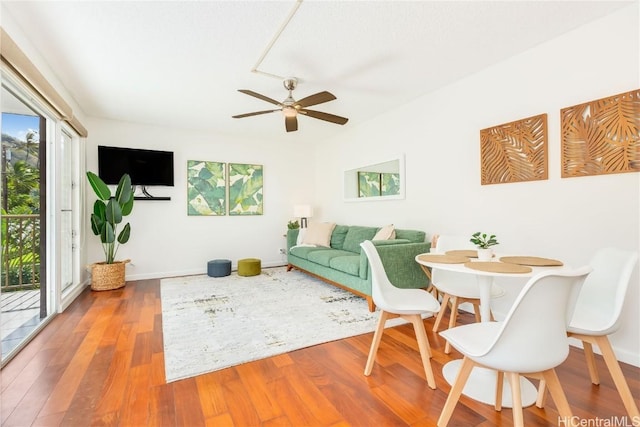 dining room featuring hardwood / wood-style floors and ceiling fan