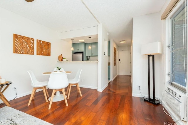 dining space with dark hardwood / wood-style floors