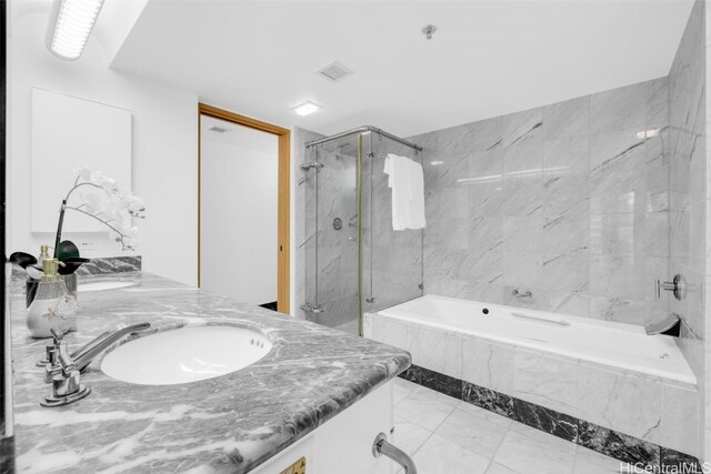 bathroom with shower with separate bathtub and vanity