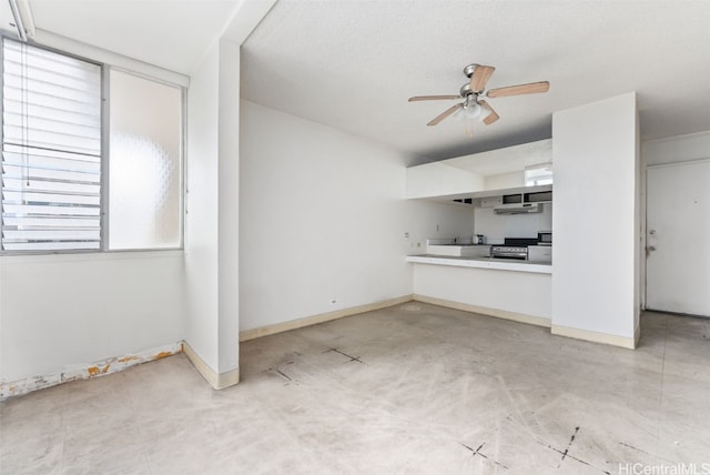 unfurnished living room with a textured ceiling and ceiling fan