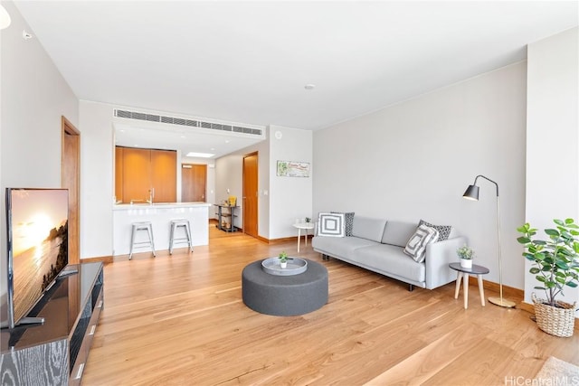 living room with light hardwood / wood-style floors