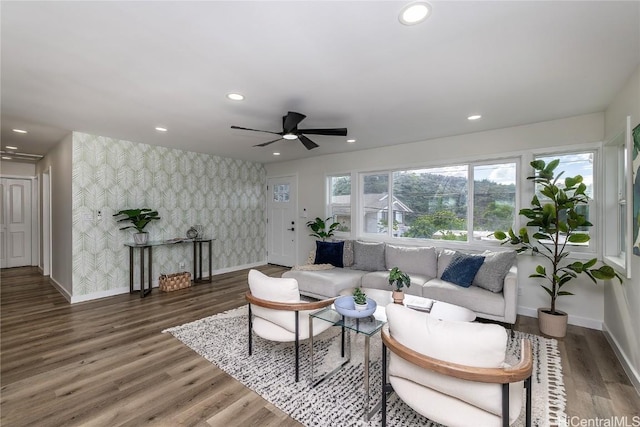 living room with dark hardwood / wood-style floors and ceiling fan