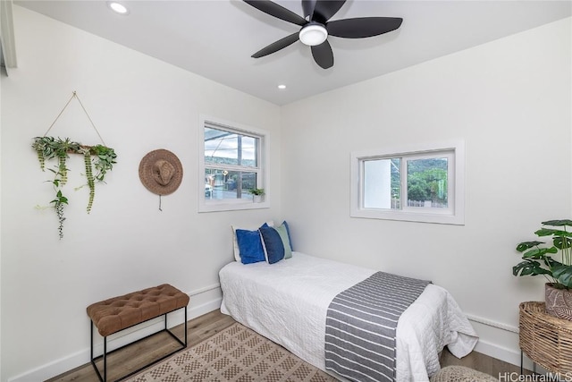 bedroom featuring wood-type flooring and ceiling fan