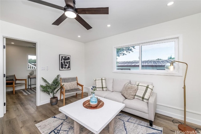 living room with ceiling fan, a healthy amount of sunlight, and wood-type flooring