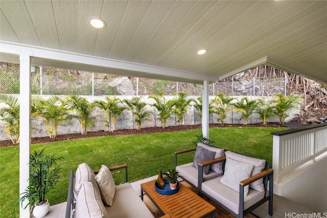 sunroom featuring wood ceiling and a healthy amount of sunlight