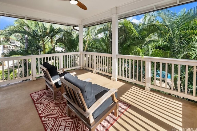 wooden terrace featuring ceiling fan