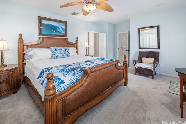 bedroom featuring ceiling fan and light carpet