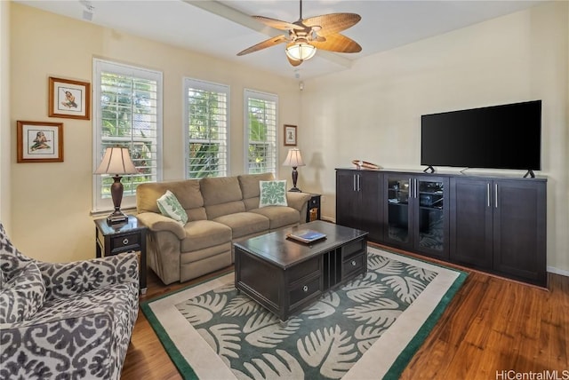 living room with dark hardwood / wood-style floors and ceiling fan