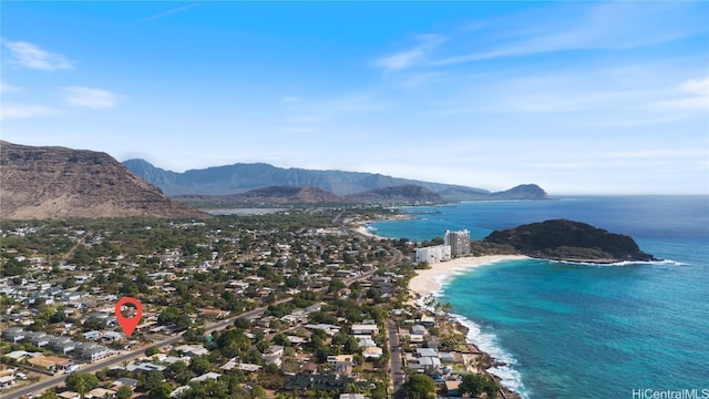 drone / aerial view with a water and mountain view