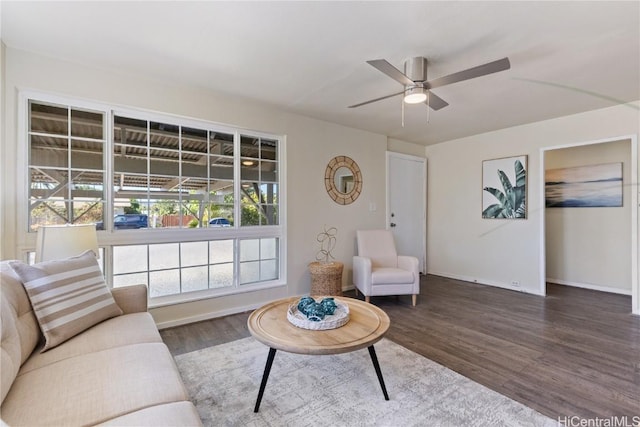 living room with hardwood / wood-style flooring and ceiling fan