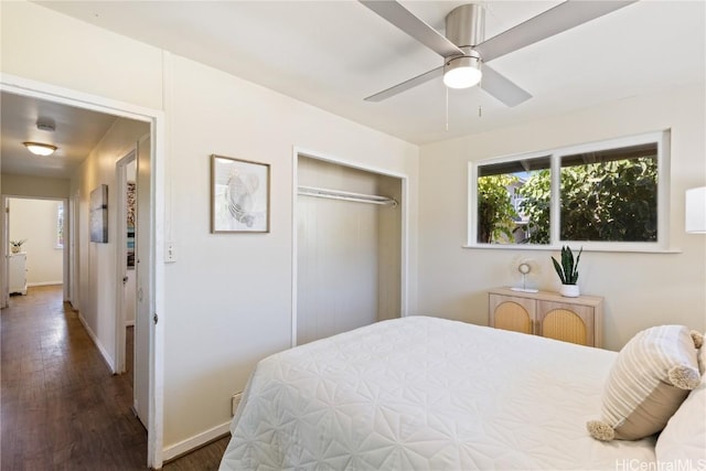 bedroom with ceiling fan, dark hardwood / wood-style floors, and a closet