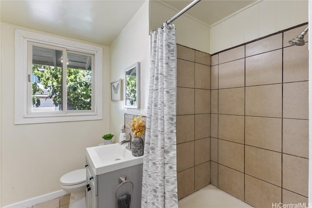 full bathroom with tile patterned flooring, shower / bath combo with shower curtain, vanity, and toilet