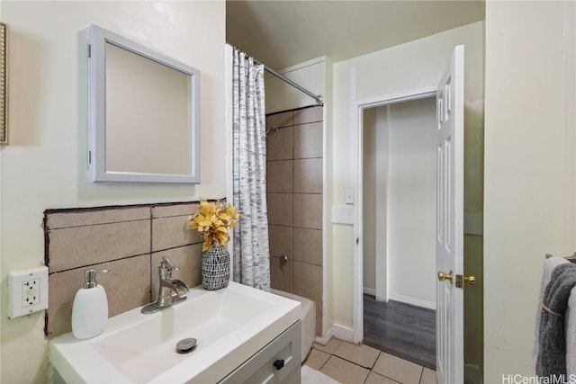 bathroom with tile patterned floors and vanity