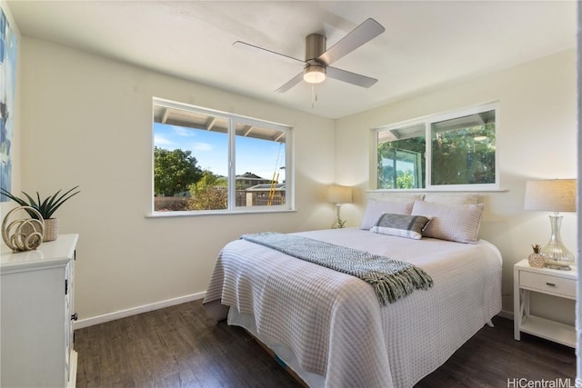 bedroom featuring multiple windows, ceiling fan, and dark wood-type flooring