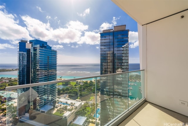 balcony featuring a water view