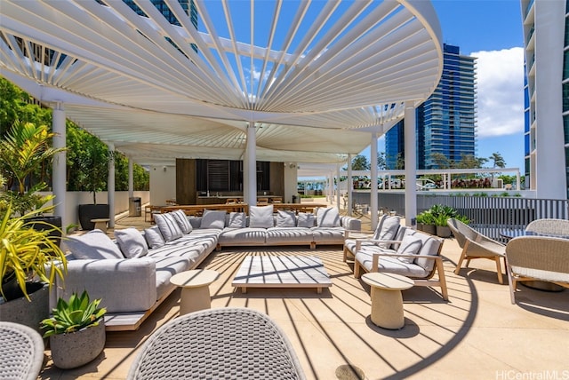 view of patio / terrace featuring a pergola and an outdoor hangout area