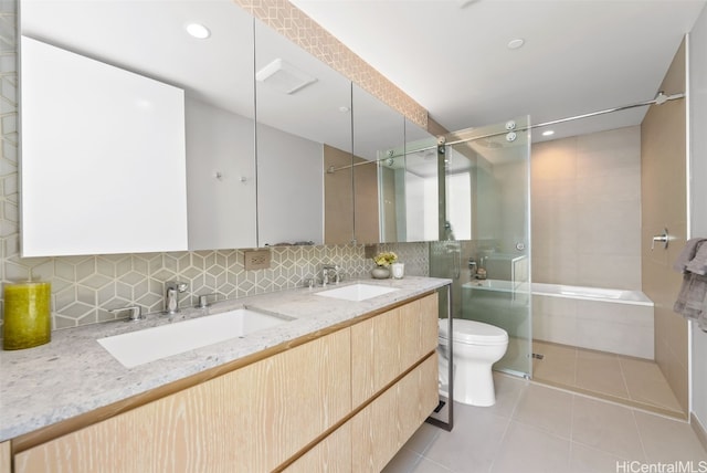 full bathroom with vanity, plus walk in shower, tile patterned floors, decorative backsplash, and toilet