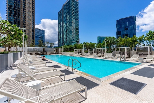 view of swimming pool featuring a patio area