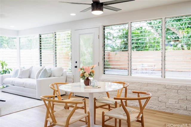 sunroom / solarium with ceiling fan